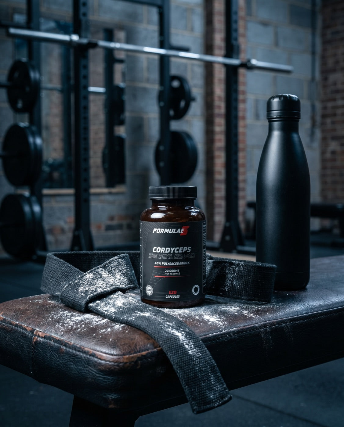 Sport essentials - performance supplements on a gym bench